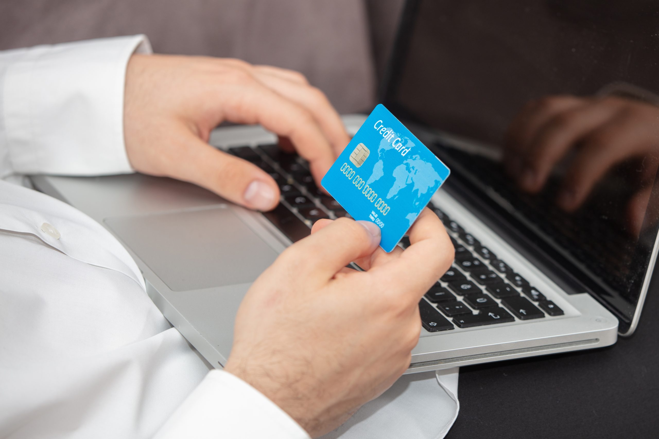 Person Inputting Details Its Credit Card Laptop Scaled