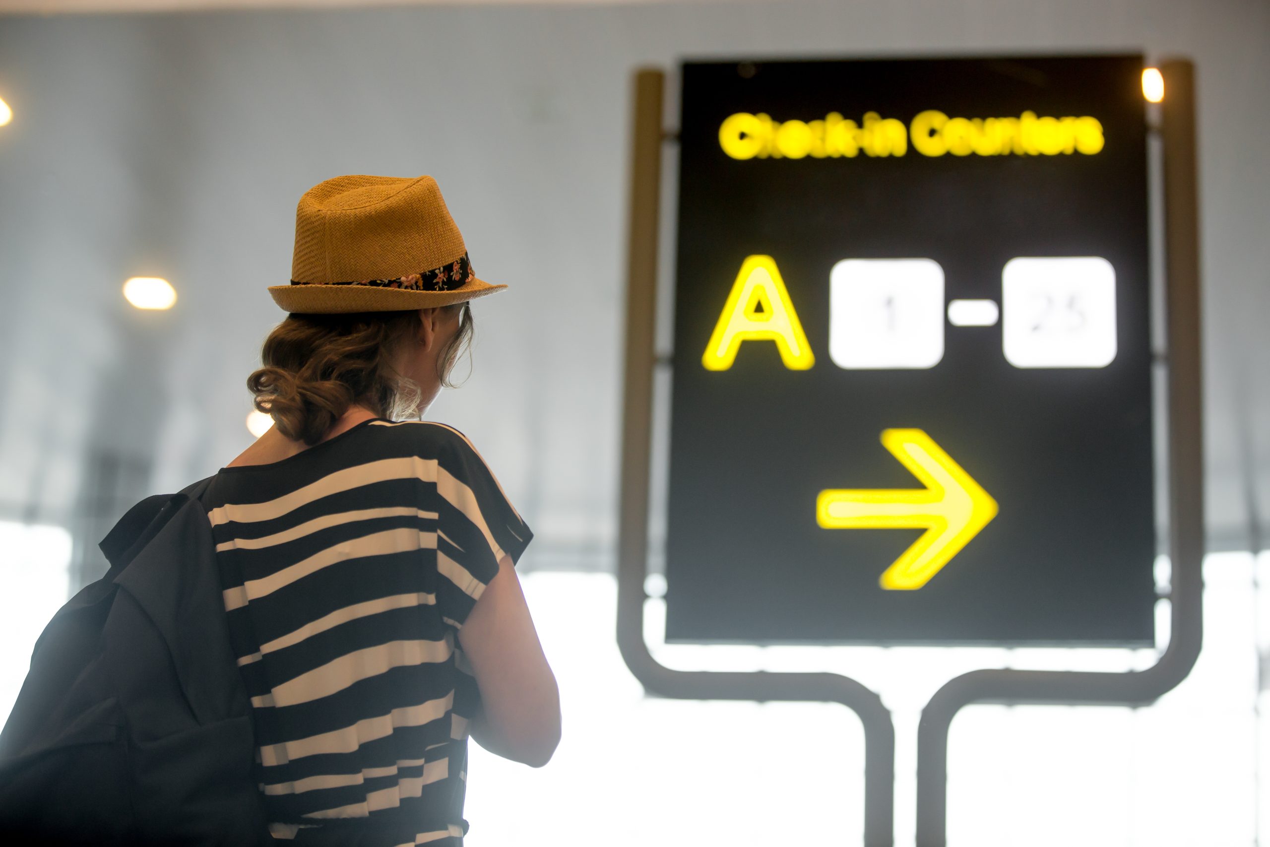Girl Looking Airport Information Board Scaled